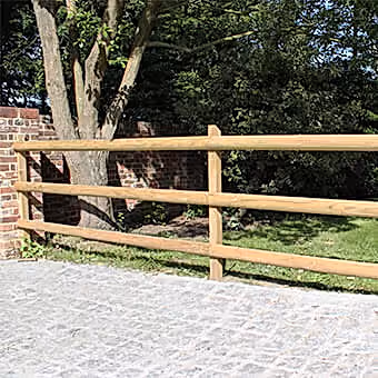 Post and rail fencing in garden