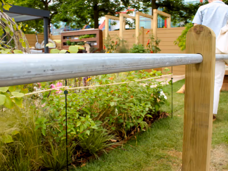 wooden post metal bar fencing