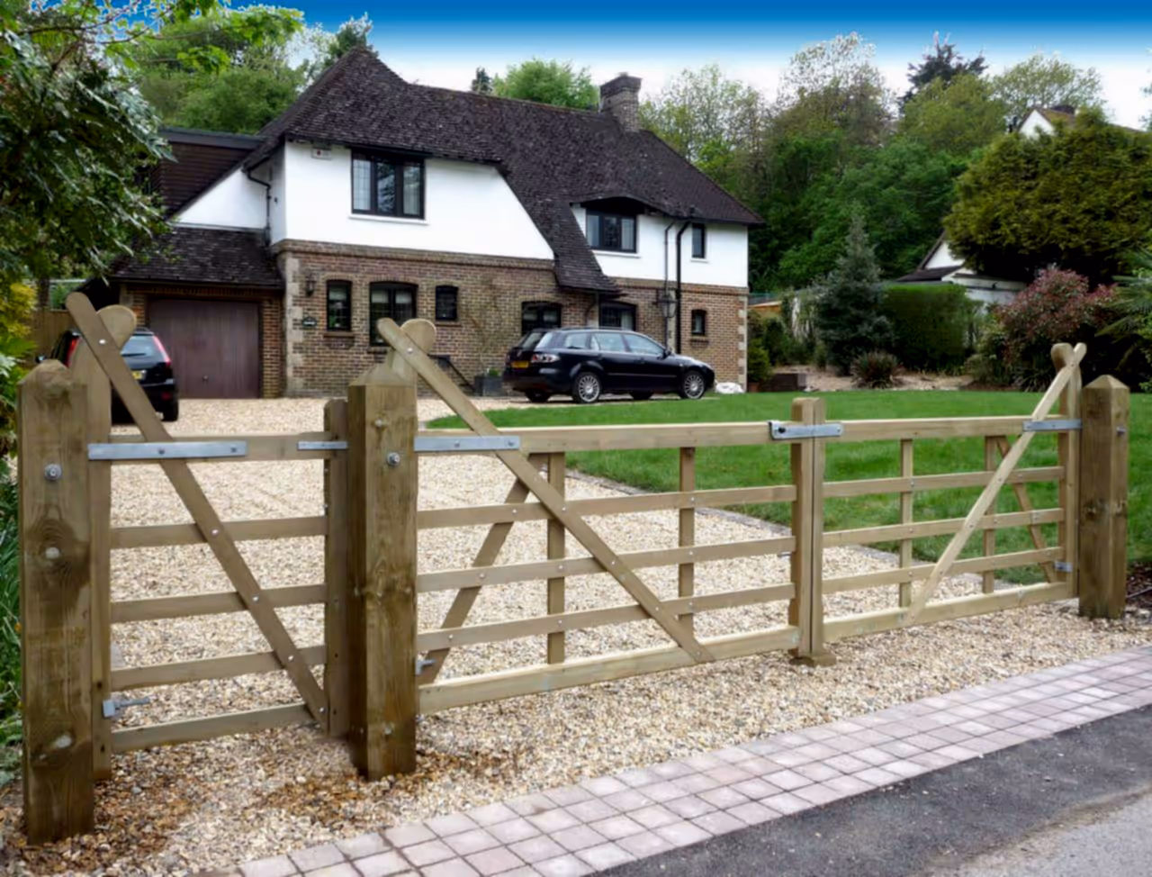 Timber entrance gates on driveway