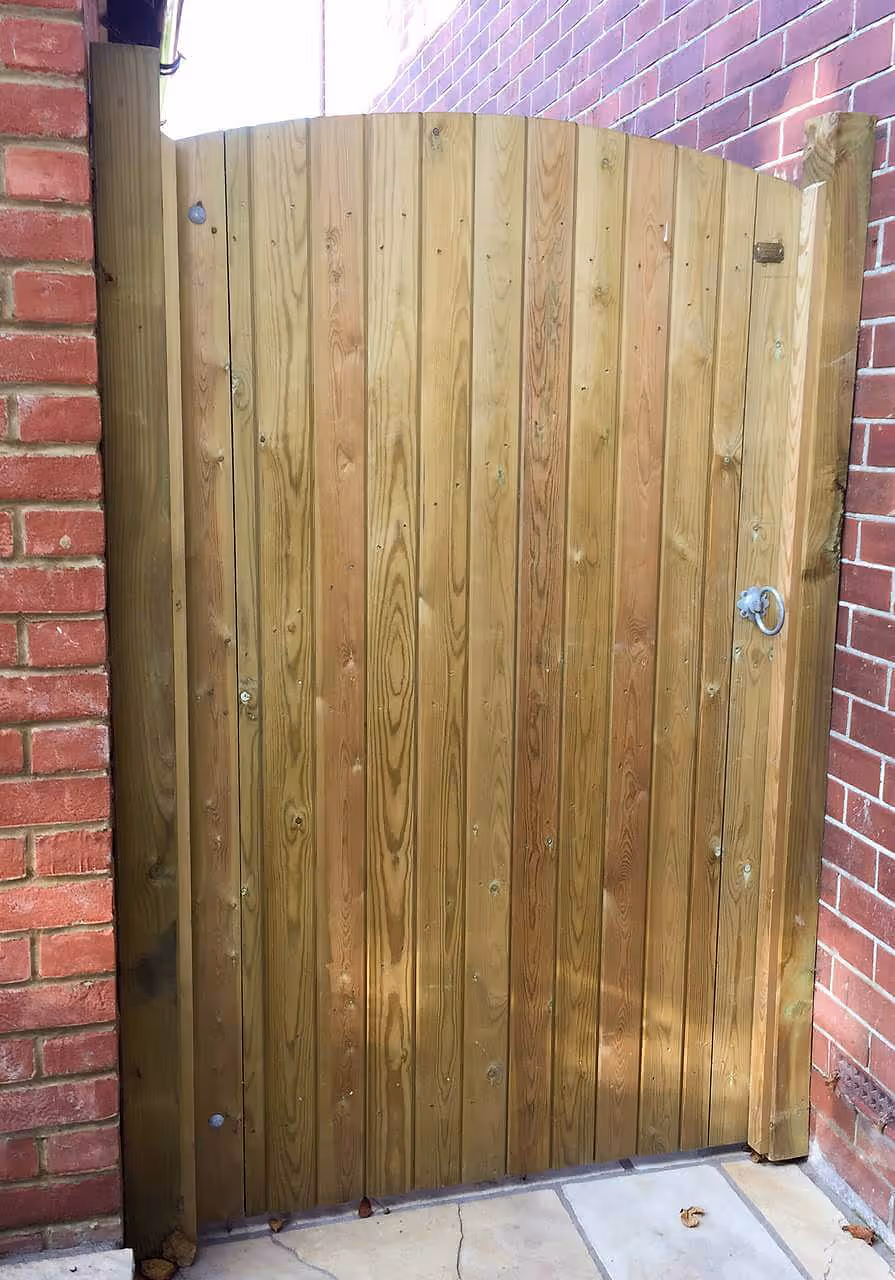 Arched top Garden Gate installed with wall plates