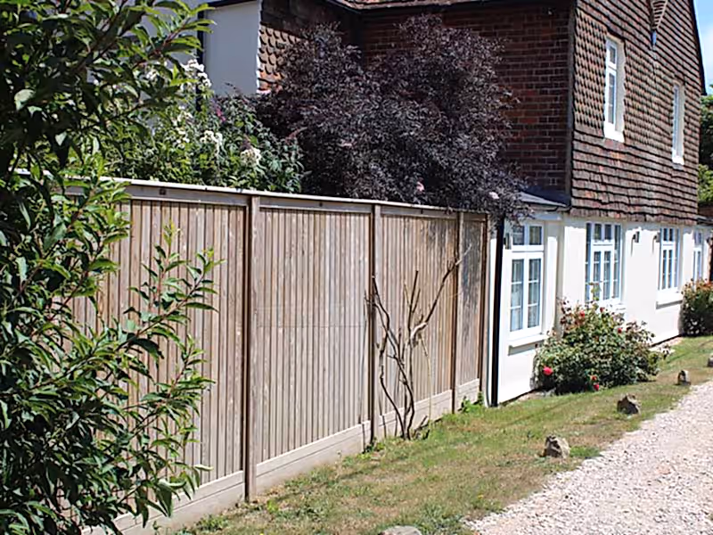 Vertical Tongue and Groove Effect fence panels in garden