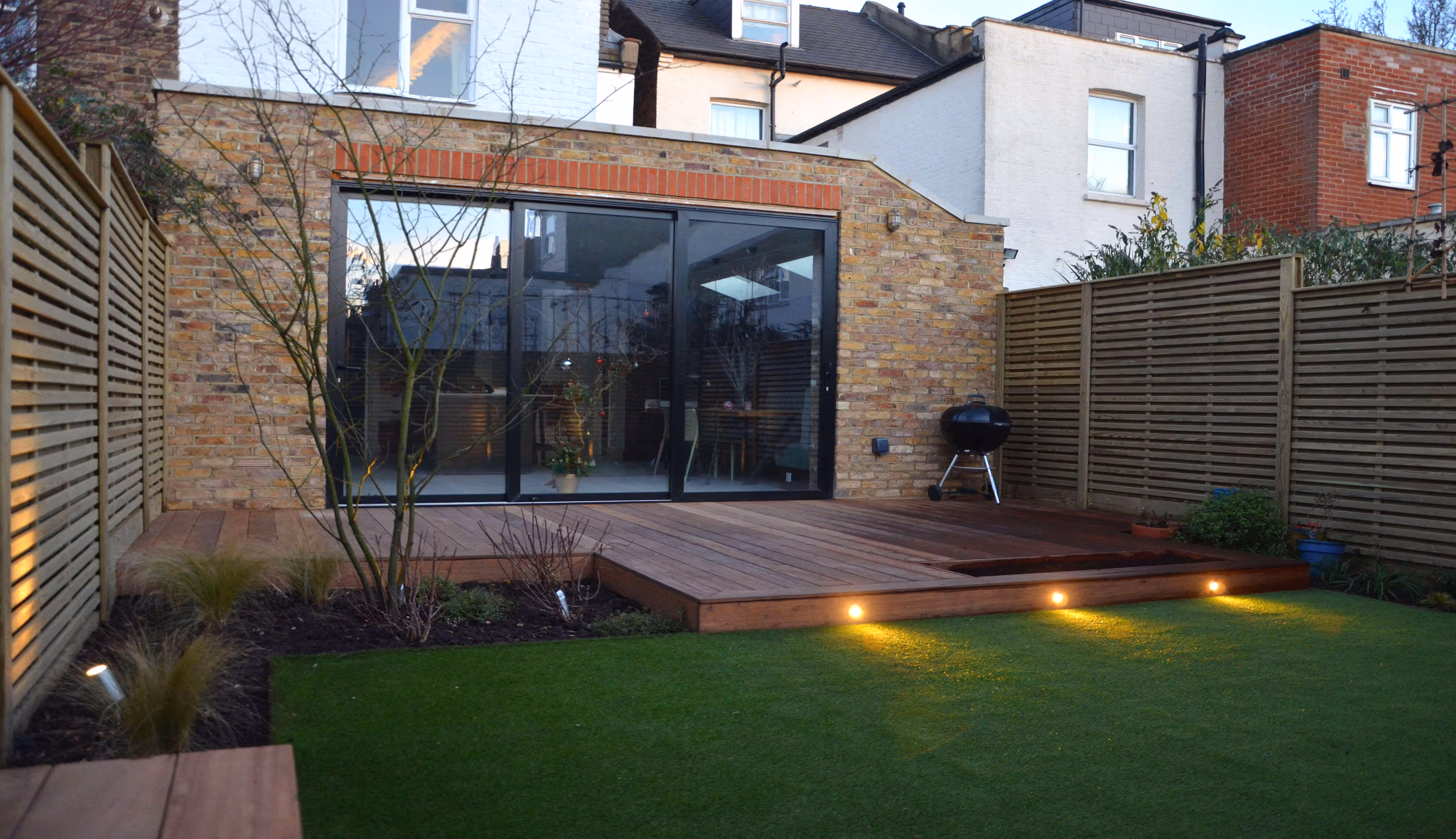 Fencing shot towards house and extension