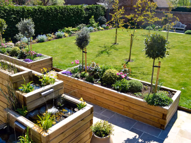 Treated Timber contemporary sleepers raised bed and pond