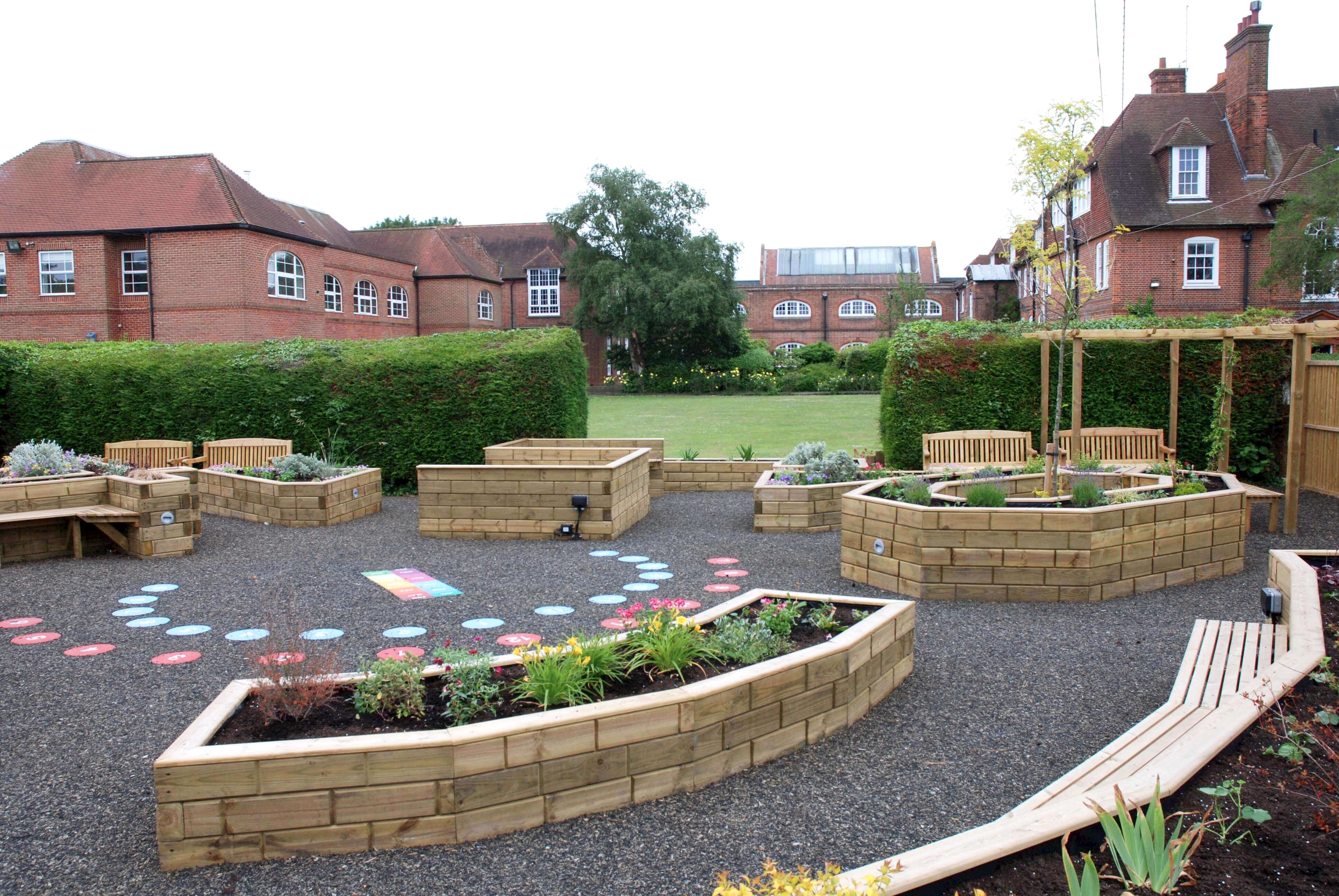 Timber retaining walls raised beds in garden