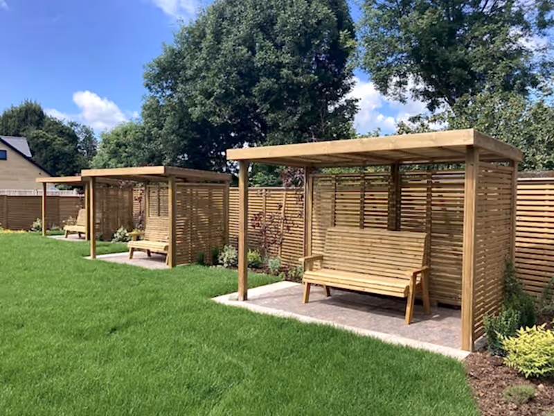 wooden garden shelter with sides