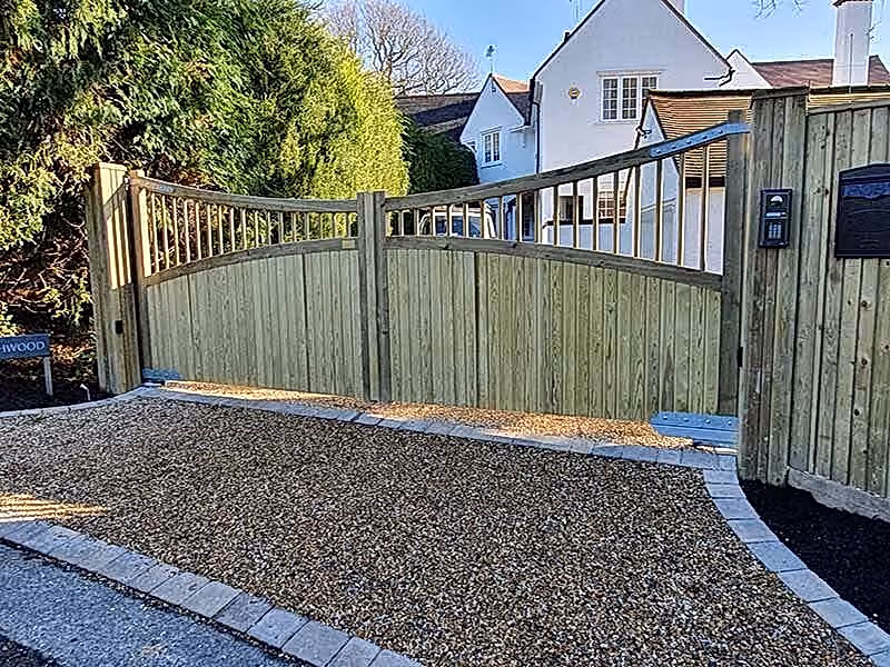 Custom wooden driveway gates bring ideal garden design to life