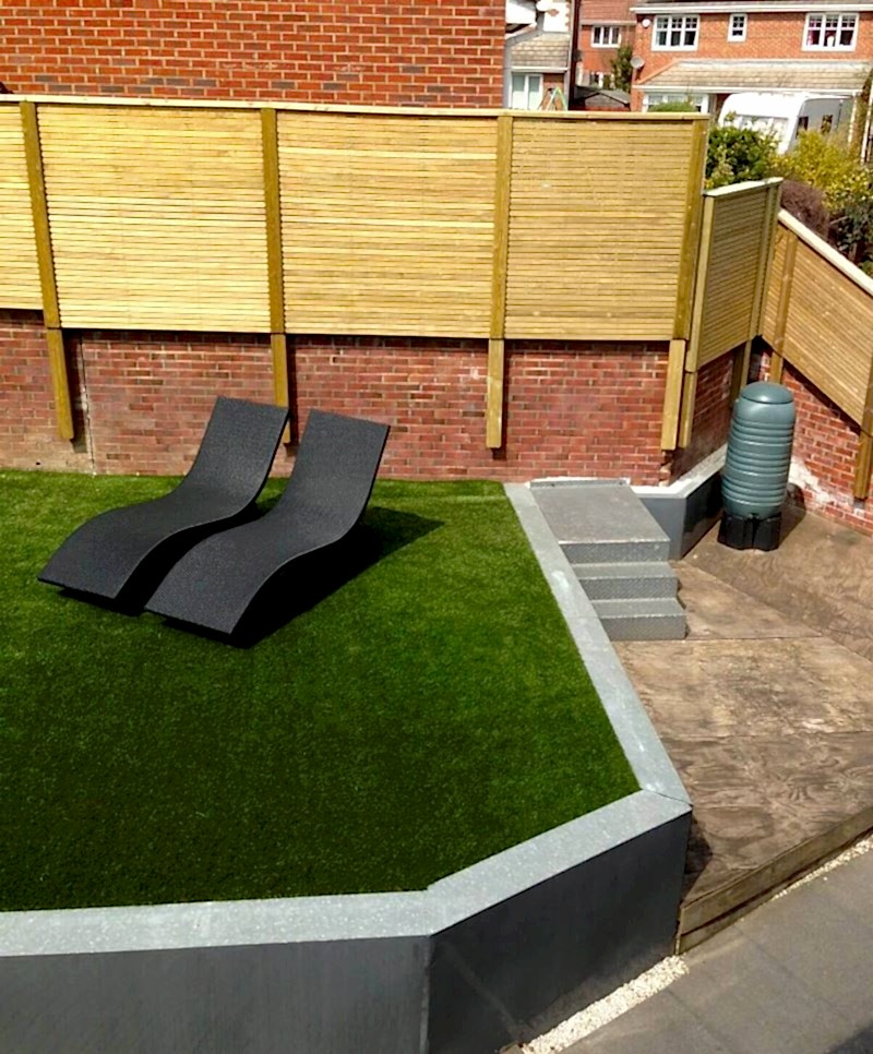Garden long view with venetian fence above wall