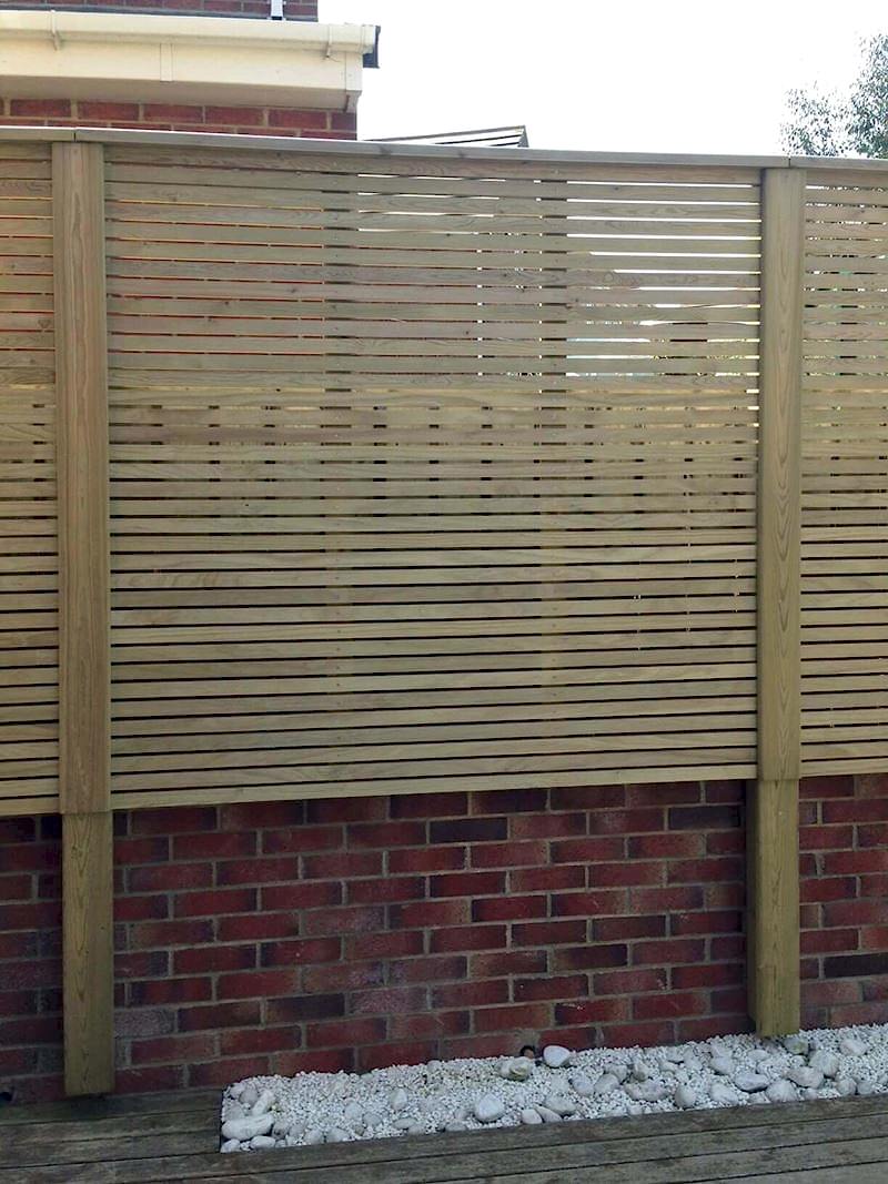 venetian style fence attached above wall with wall plates