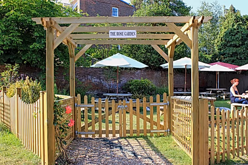 Create inviting entrances to gardens with a pergola