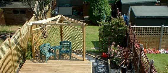 Jacksons Fencing garden design decking with fencing panels palisade shelter