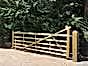 Traditional entrance gate covering driveway