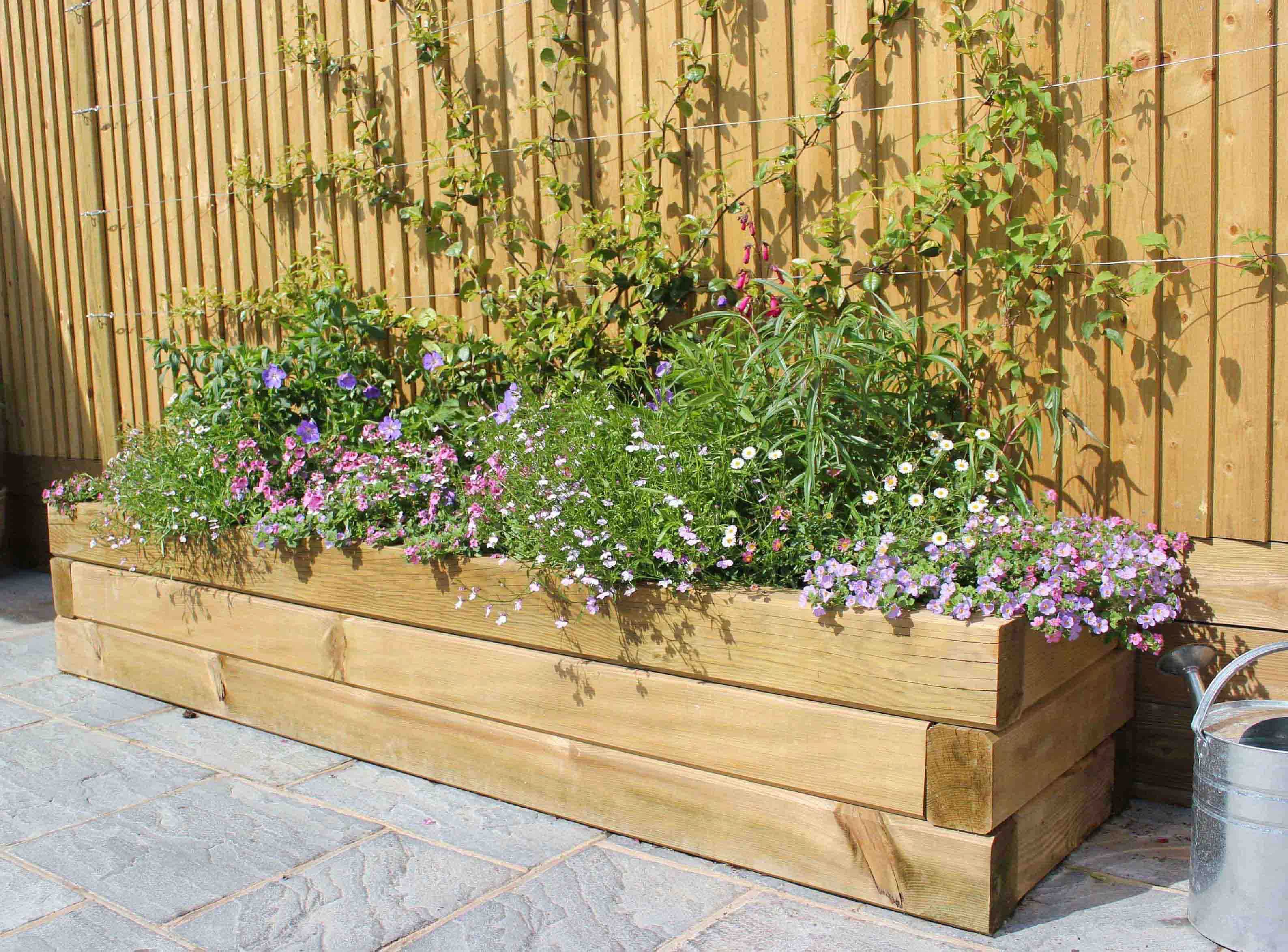 Modern Timber sleepers raised Bed