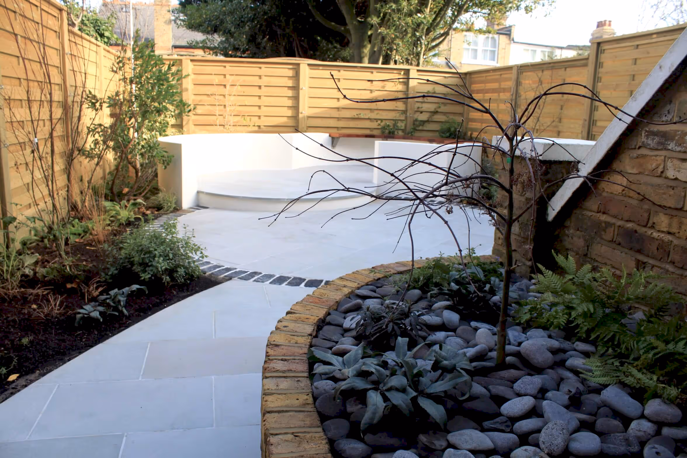 Hit and Miss fence panels planting and patio