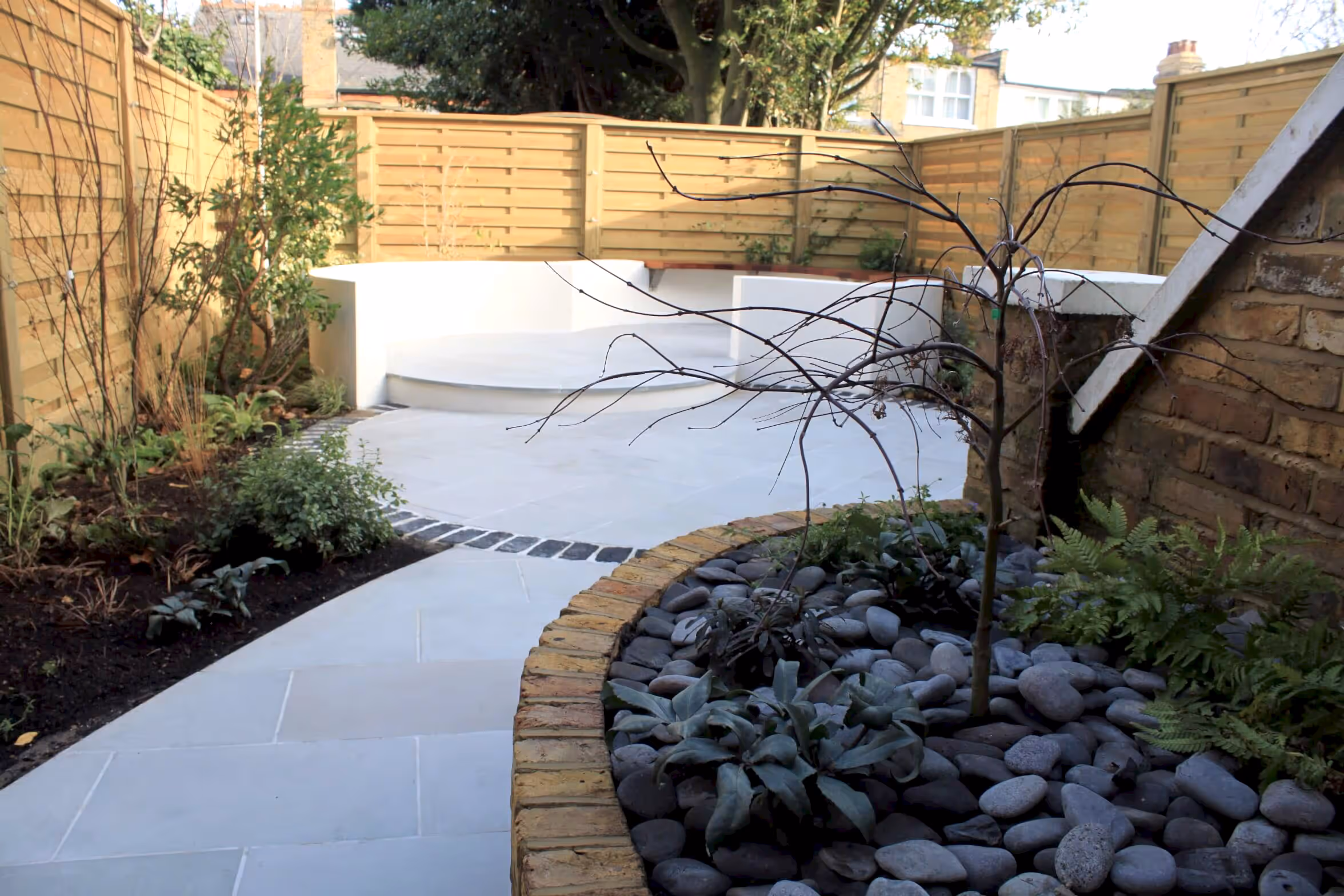 Hit and Miss fence panels planting and patio