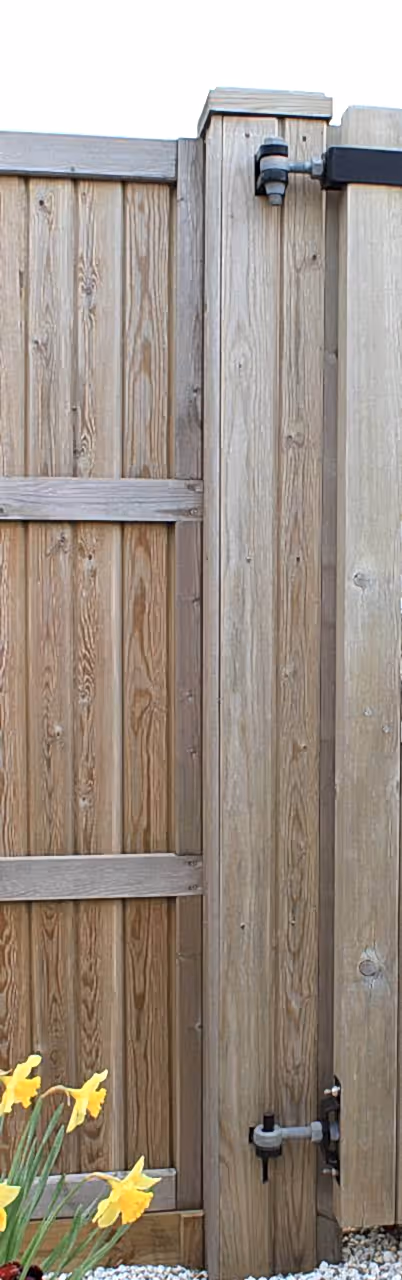 Courtyard gate post with timber cladding
